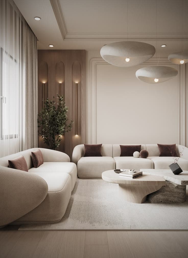 Living room with sculpted wall detailing, curved statement seating and a low round table